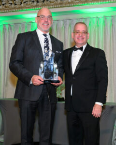 Photo of Dr. Crossman receiving the Visionary Award