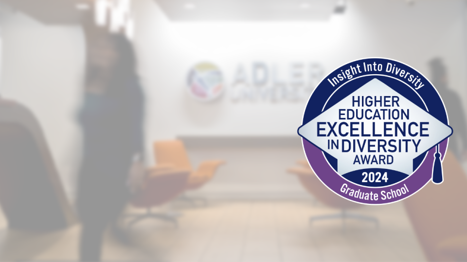 A large HEED Award 2024 badge is overlaid on a blurred office lobby with the Adler University logo in the background, highlighting higher education diversity excellence.