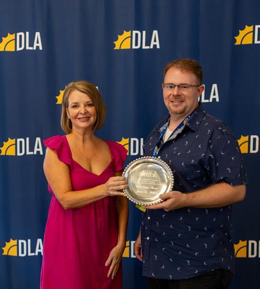Photo of Dr. Halbert receiving DLA award