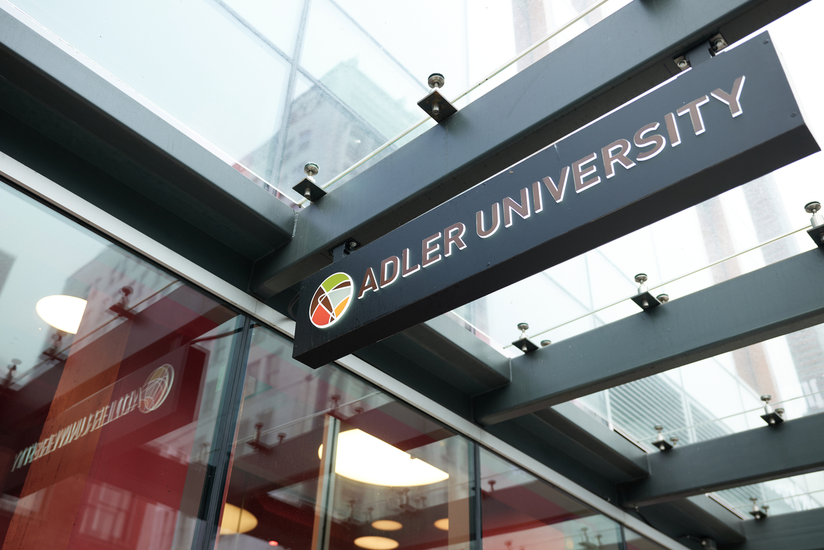 University name and logo sign at the Vancouver Campus entrance.