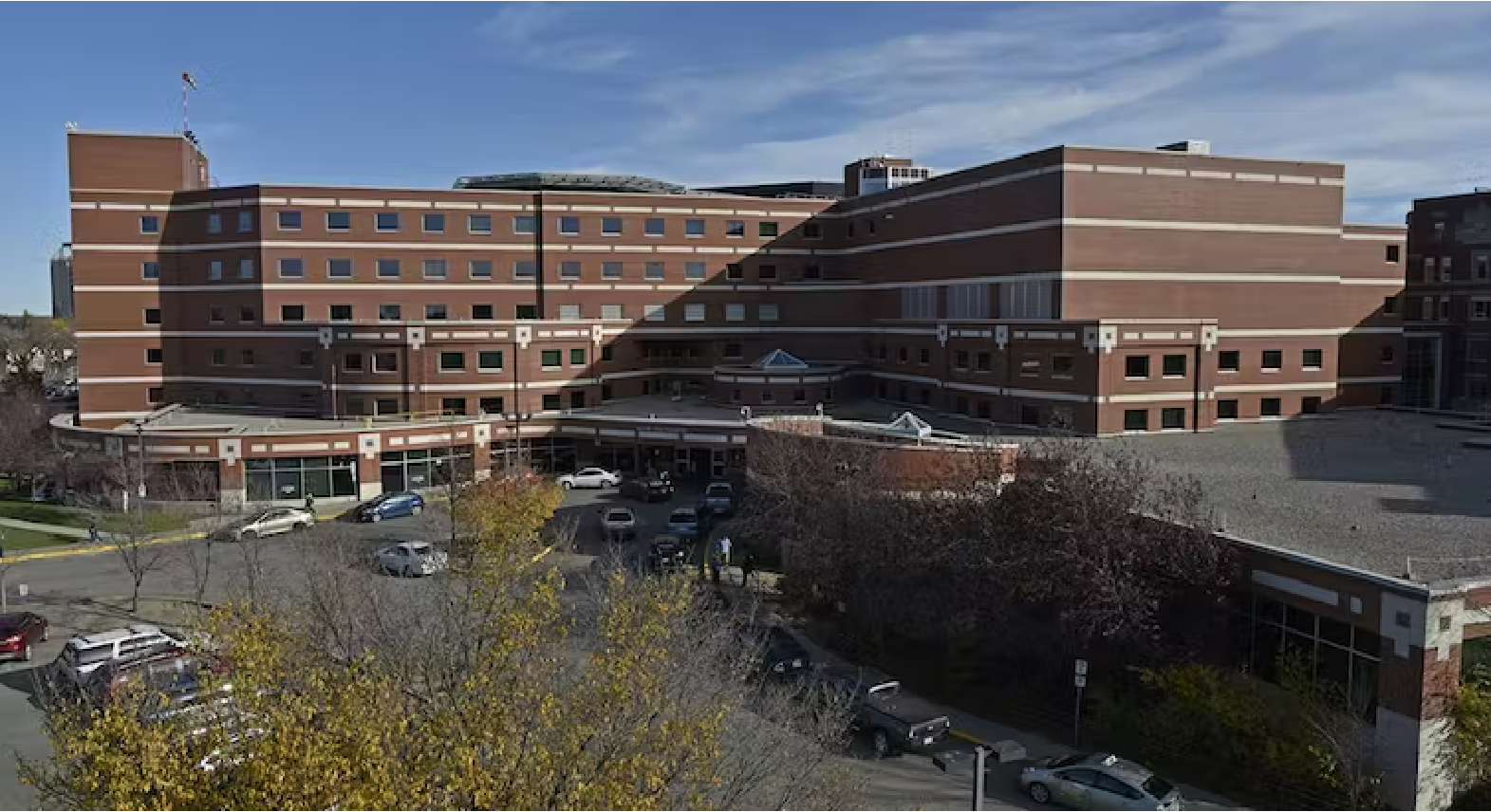 Image of Regina General Hospital (brick building with trees and landscaping).