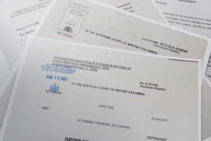 Official Canadian Supreme Court documents spread out.